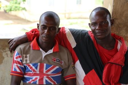 Nyuma(left) and Sahr attend post ebola community preparedness meeting in Kangama town